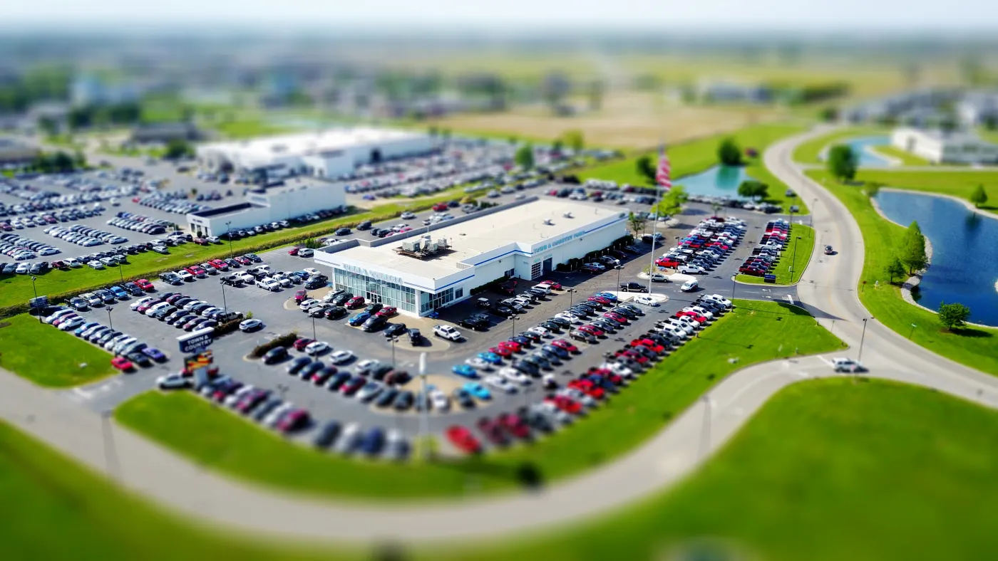 An aerial view of a yard full of vehicles